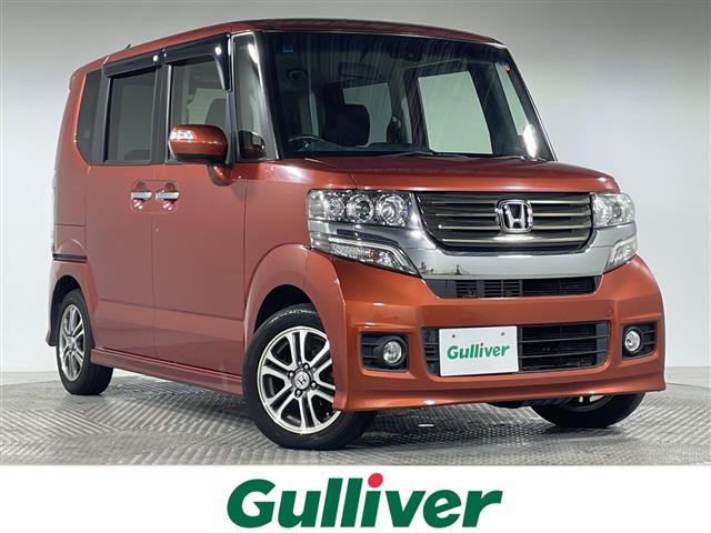 Ｎ−ＢＯＸカスタム(ホンダ) Ｇ・Ａパッケージ　ＣＴＢＡ　純正ナビ　バックカメラ　両側電動スライドドア　ＥＣＯＮ　スマートキー　スペアキー　プッシュスタートボタン　ステアリングスイッチ　Ａｕｔｏライト　ＨＩＤヘッドライト　電動格納ミラー　純正マット 中古車画像