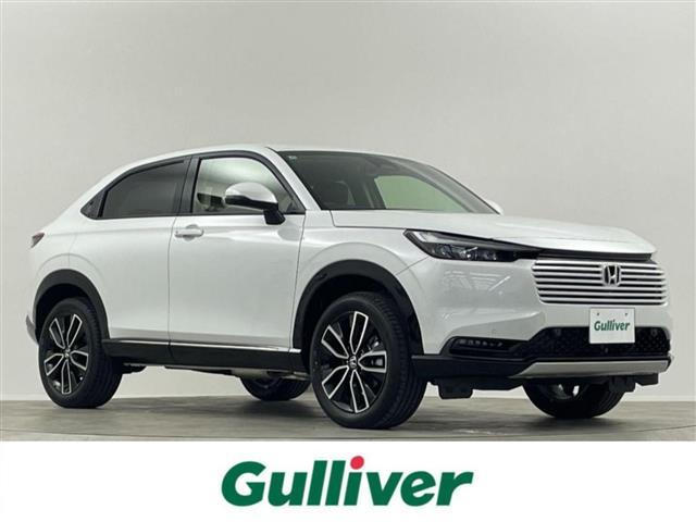 ヴェゼル(ホンダ) ｅ：ＨＥＶ　Ｚ　登録済未使用車　純正９型ＤＡ　ＴＶ　ＢＴ　ＥＴＣ２．０　ＢＳＭ　バックカメラ　置くだけ充電　電動リアゲート　シートヒーター　ハーフレザーシート　ダウンヒルアシストコントロール　ハンドルヒーター 中古車画像