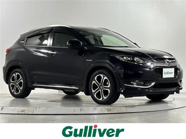 ヴェゼル(ホンダ) ハイブリッドＺ・ホンダセンシング　純正９型ナビ　衝突軽減システム　バックカメラ　クルーズコントロール　ハーフレザーシート　シートヒーター　純正アルミホイール　純正フロアマット　ルーフレール　ＬＥＤヘッドライト　オートライト 中古車画像