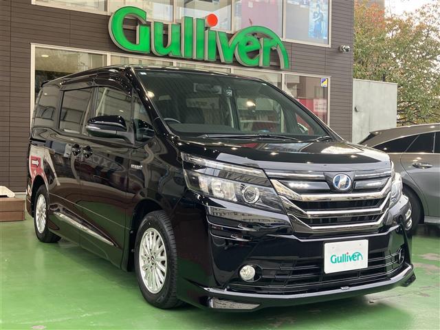 ヴォクシー ハイブリッドV BT接続 SDナビゲーション シートヒー スマートキープッシュスタート DVD再生可 Aライト Bモニター オートクルーズ Wエアバック ナビTV ESC ETC車載器 リモコンキー PS 3列(1枚目)