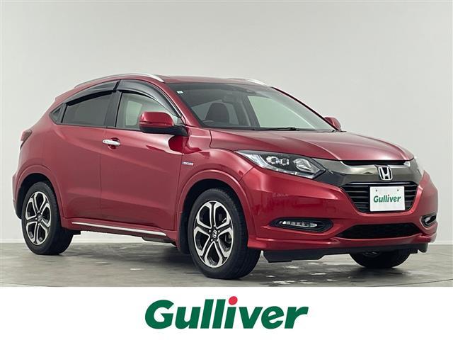 ヴェゼル(ホンダ) ハイブリッドＺ・ホンダセンシング　禁煙　純正８型ナビ　ＢＴ　温シート　Ｂカメラ　ＥＴＣ　レーダークルーズコントロール　衝突軽減システム　ドライブレコーダー　ルーフレール　ハーフレザーシート　スマートキー　純正ＬＥＤヘッドライト 中古車画像