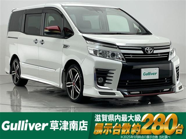 ヴォクシー ZS 煌 禁煙車/社外エアロ(NOBLESS)/社外18インチアルミホイール(共豊)/社外メモリーナビ/フリップダウンモニター/バックカメラ/レーンキープアシスト/オートハイビーム/LEDヘッドライト/ETC(1枚目)