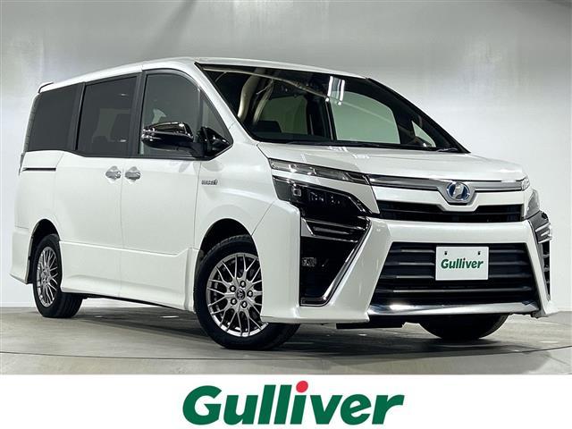 ヴォクシー(トヨタ) ハイブリッドＺＳ　煌　純正１０型ナビ　フルセグＴＶ　バックカメラ　１２型後席フリップダウンモニター　ビルトインＥＴＣ　両側パワースライドドア　純正１６インチアルミホイール　クルーズコントロール　セーフティセンスＣ 中古車画像