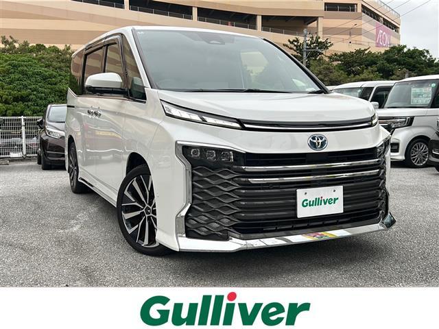 ヴォクシー(トヨタ) ハイブリッドＳ−Ｚ　純正１０．５ナビ（ＡＭ／ＦＭ／ＣＤ／ＤＶＤ／ＢＴ）　フルセグＴＶ　　全方位カメラ　前後ドラレコ　衝突軽減装置　両側パワスラ　追従クルーズコントロール　電動リアゲート　シートヒーターＤ／Ｎ席 中古車画像