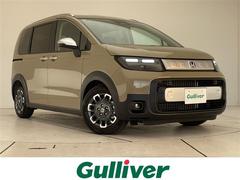 フリード e:HEVクロスター 登録済未使用車 純正9型ディスプレイオーディオナビ 両側パワースライドドア レーダークルーズコントロール シートヒーター バックカメラ コーナーセンサー ブラインドスポットモニター LEDヘッドライト 中古車画像