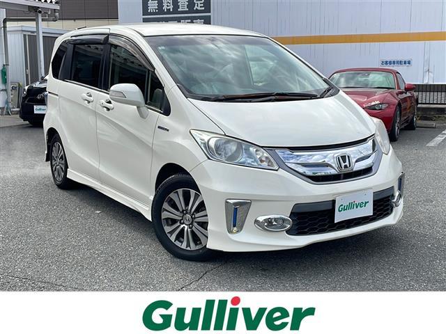 フリードハイブリッド ジャストセレクション 純正ナビ/DVD/MSV/ワンセグ Bカメラ 両側パワスラ 純正HID 純正フォグ オートライト ハーフレザーシート 革巻ステア ステアリングスイッチ クルコン スマートキー ビルトインETC マット(1枚目)