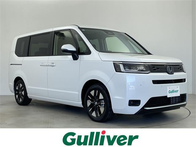 ステップワゴン(ホンダ) ｅ：ＨＥＶエアー　ＥＸ　登録済未使用車　ホンダセンシング　純正１１．４型ナビ　パドルシフト　アダプティブクルーズコントロール　電動リアゲート　バックカメラ　両側パワースライドドア　オットマン　オートハイビーム　オートホールド 中古車画像