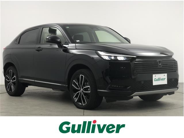 ヴェゼル(ホンダ) ｅ：ＨＥＶ　Ｚ　ワンオーナー　純正ナビ　バックカメラ　置くだけ充電　ドラレコ　ＢＳＭ　ＥＴＣ２．０　ハーフレザー　シートヒーター　ステアリングヒーター　電動リアゲード　　純正１８インチＡＷ　衝突軽減システム　ＡＣＣ 中古車画像