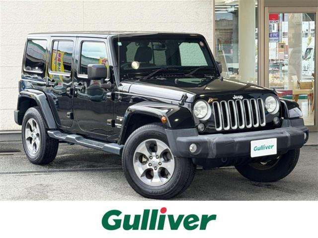 ジープ・ラングラーアンリミテッド(ジープ) サハラ　ワンオーナー／Aftermarket７インチナビ（ＡＶIntercooler−ＲＺ８００）（ＡＭ／ＦＭ／ＣＤ／ＤＶＤ／ＢＴ）／フルセグＴＶ／バック・サイドカメラ／アルパインサウンド／４ＷＤ／ＥＴＣ／ステアリングリモコン／クルコン 中古車画像