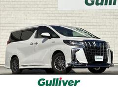 アルファードハイブリッド エグゼクティブラウンジS 禁煙車 モデリスタエアロ モデリスタマフラー ツインサンルーフ JBL 黒革シート 純正後席モニター 全方位カメラ パワーバックドア AC100V パワーシート ハンドルヒート 前後ドラレコ ETC 中古車画像