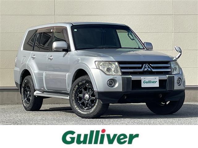 パジェロ(三菱) ロング　エクシード　Ｃａｒｒｏｚｚｅｒｉａナビ（ＡＭ／ＦＭ／ＤＶＤ／Ｂｌｕｅｔｏｏｔｈ／フルセグ）／バックカメラ／ＲｏｃｋＦｏｒｄカーオーディオ／ＥＴＣ／３列シート／ＸＴＥＲＥＭＥ−Ｊアルミホイール／背面タイヤ／パワステ 中古車画像