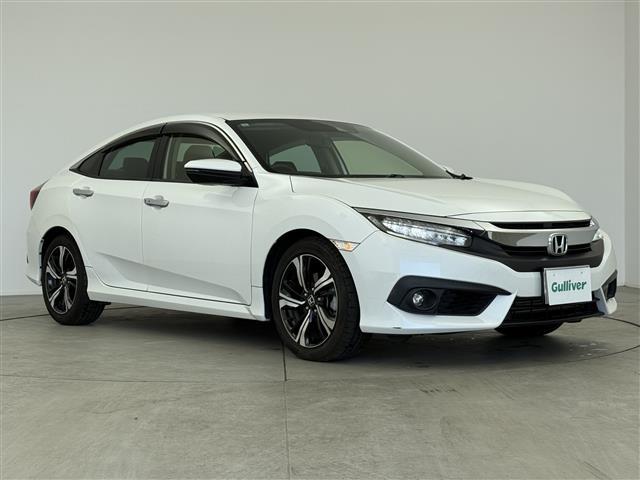 シビック(ホンダ) セダン　ホンダセンシング　純正ナビ　ＥＴＣ　Ｂカメラ　ＡＣＣ　ドラレコ前　衝突軽減ブレーキ　レーンキープアシスト　シートヒーター　本革シート　パワーシート　オートハイビーム　ＬＥＤライト　スマートキー　純正フロアマット 中古車画像