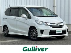 フリードハイブリッド ハイブリッド プレミアムエディション 純正ナビ フリップダウンモニター フルセグ DVD再生 バックカメラ 両側パワースライドドア クルーズコントロール HIDオートライト ドラレコ ETC スマートキー 社外15AW 中古車画像