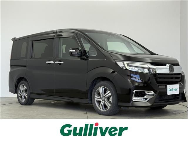 ステップワゴンスパーダ(ホンダ) ｅ：ＨＥＶスパーダ　Ｇ　ホンダセンシング　ホンダセンシング　衝突被害軽減ブレーキ　誤発進抑制機能　アダプティブクルーズコントロール　先行車発進お知らせ機能　両側パワースライド　フリップダウンモニター　純正ナビ　フルセグＴＶ　プッシュスタート 中古車画像