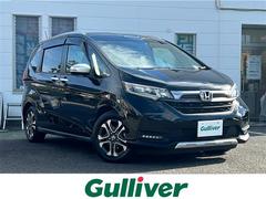 フリード クロスター・ホンダセンシング 禁煙車/社外8インチナビ/フルセグTV/Bluetooth/バックカメラ/フリップダウンモニター/ドライブレコーダー/CMBS/LKAS/アダプティブクルーズコントロール/シートヒーター 中古車画像