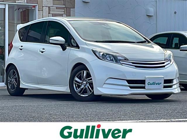 ノート(日産) ライダー　Ｖセレクション＋セーフティ　純正７型ナビ／ビルトインＥＴＣ／前後ドライブレコーダー／AftermarketＡＵＴＥＣＨ１５インチアルミホイール／純正キセノンヘッドライト／Aftermarketフロアマット／スマートキー／スペアキー／オートライト／リアウィング 中古車画像