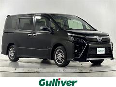 ヴォクシー ハイブリッドZS 煌III 純正9型ナビ クルコン バックカメラ ETC 前後ドラレコ ウォークスルー 純正フロアマット ハーフレザーシート シートヒーター 両側パワスラ 純正16インチAW 横滑り防止装置 コーナーセンサー 中古車画像