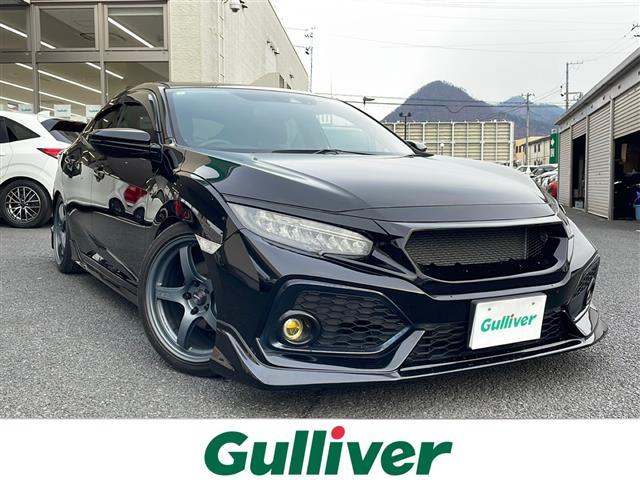 シビック(ホンダ) ハッチバック　ホンダセンシング　・無限エアロ・無限ステアリング・無限シフトノブ・無限テールレンズ・ブリッツDampersＺＺ−Ｒ・ブリッツマフラー・ブリッツエアクリーナー・ＨＫＳブローオフバルブ・ＲＡＹＳ　１８インチアルミ 中古車画像