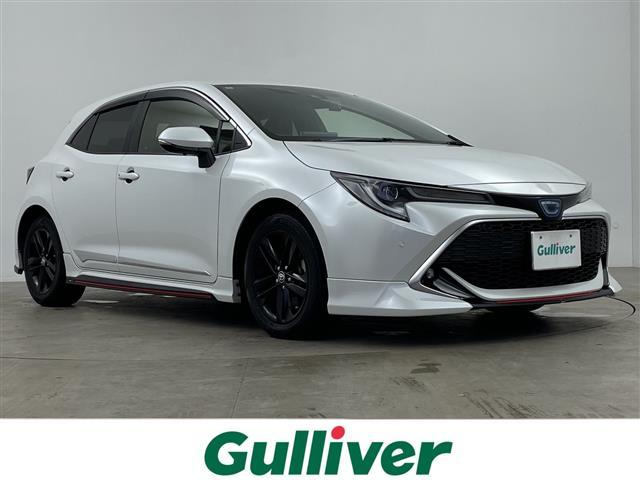 カローラスポーツ(トヨタ) ハイブリッドＧ　スタイルパッケージ　ＴＲＤエアロフロント／リア／サイド／ＴＲＤドアハンドルプロテクターＴＲＤペダルカバー／サイドドアアンダーガーニッシュ／ステアリングガーニッシュ／純正９インチディスプレイオーディオＣＤＤＶＤＴＶあり 中古車画像