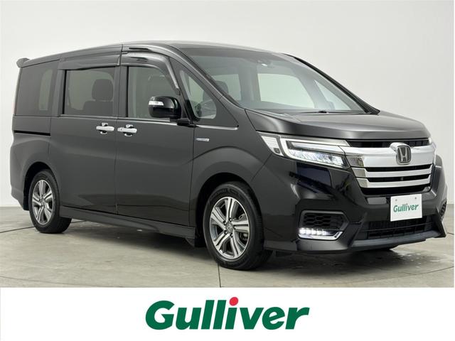 ステップワゴンスパーダ(ホンダ) スパーダハイブリッド　Ｇ　ホンダセンシング　ホンダセンシング　衝突被害軽減ブレーキ　誤発進抑制機能　アダプティブクルーズコントロール　先行車発進お知らせ機能　フリップダウンモニター　全方位カメラ　両側パワースライドドア　ドライブレコーダー 中古車画像