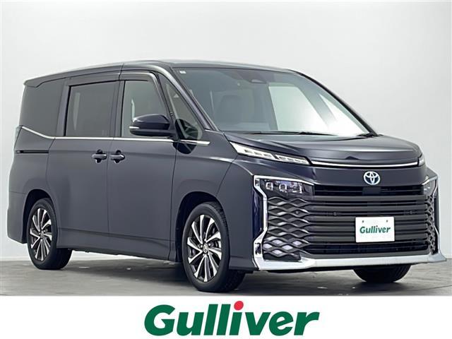 ヴォクシー(トヨタ) ハイブリッドＳ−Ｚ　純正１０．５インチＤＡナビ　快適利便パッケージＨｉｇｈ　ユニバーサルステップ　プロジェクター三眼ＬＥＤライト　パワーバックドア　トヨタセーフティセンス　前後シートヒーター　両側パワスラ　追従クルコン 中古車画像