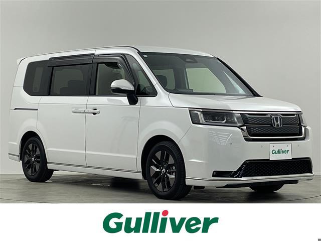 ステップワゴン(ホンダ) ｅ：ＨＥＶスパーダ　純正１１．４型ナビ　Ｂカメラ　温シート　ＢＳＭ　ＥＴＣ　両側パワースライドドア　パワーバックドア　オットマン　ハーフレザーシート　オートハイビーム　コーナーセンサー　レーンキープアシスト　純正ＬＥＤ 中古車画像