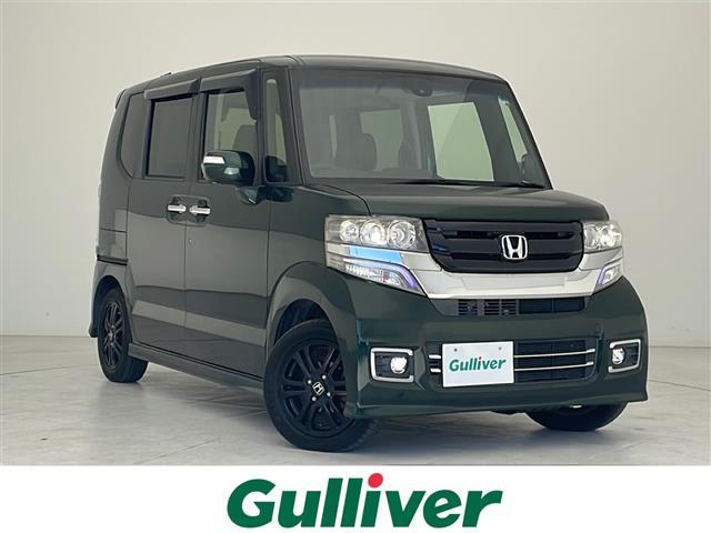 Ｎ−ＢＯＸカスタム(ホンダ) Ｇ　ＳＳブラックスタイルパッケージ　禁煙車　純正ナビ　Ｂｌｕｅｔｏｏｔｈ　ＴＶ　ＣＤ　両側パワースライドドア　バックカメラ　シートヒーター　オートエアコン　スマートキー　後席サンシェード　チップアップシート　純正アルミ　純正フロアマット 中古車画像