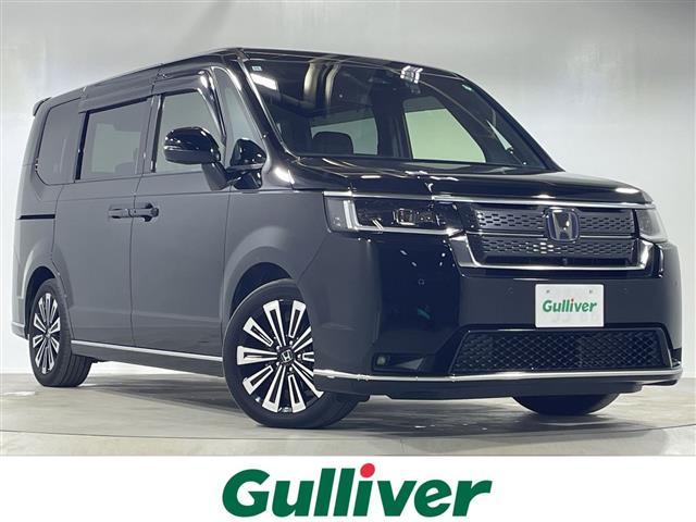 ステップワゴン(ホンダ) ｅ：ＨＥＶスパーダ　プレミアムライン　純正１１．４インチナビ　後席モニター　ホンダセンシング　全周囲カメラ　電動リアゲート　両側パワースライドドア　ＢＳＭ　オットマン　ワンオーナー　クルーズコントロール　コーナーセンサー　純正ＡＷ 中古車画像