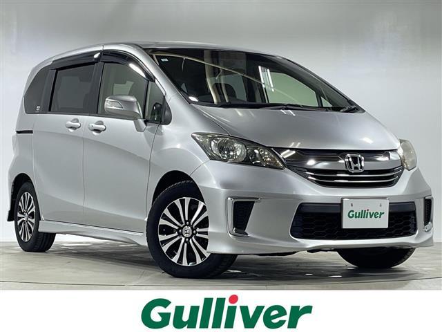 フリード(ホンダ) Ｇ　エアロ　純正７インチナビ　純正エアロ　バックカメラ　ＥＴＣ　ハーフレザーシート　革ステアリング　純正１５インチＡＷ　両側パワースライド　フロアマット　車線逸脱警報　スマートキー　オートライト　電動格納ミラー 中古車画像