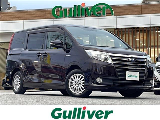 ノア(トヨタ) ハイブリッドＧ　純正ナビ　フリップダウンモニター　両側パワースライドドア　バックカメラ　ＥＴＣ　シートヒーター　オートライト　スマートキー　ＬＥＤヘッドライト　純正アルミ　ＴＶ　Ｂｌｕｅｔｏｏｔｈ　ＣＤ　ＤＶＤ 中古車画像