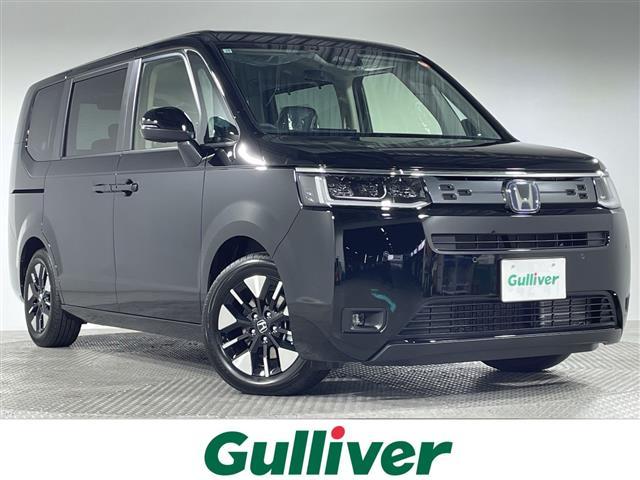 ステップワゴン(ホンダ) ｅ：ＨＥＶエアー　ＥＸ　登録済未使用車　純正１１．４型ディスプレイオーディオ　ナビ　純正１５．６型フリップダウン　バックカメラ　パワーバックドア　両側電動　ホンダセンシング　革巻ステアリング　パドルシフト　前シートヒーター 中古車画像