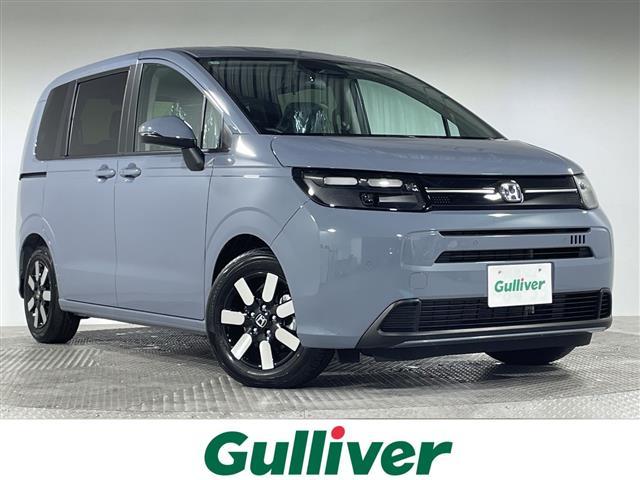 フリード(ホンダ) ｅ：ＨＥＶエアー　ＥＸ　登録済未使用車　純正９型ディスプレイオーディオ　ナビ　バックカメラ　フルセグ　両側電動　ホンダセンシング　革巻ステアリング　前席シートヒーター　ＡＨＢ　ＬＥＤヘッドランプ　スマートキー　プッシュＳ 中古車画像