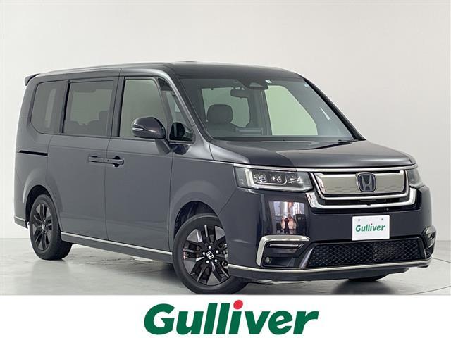 ステップワゴン(ホンダ) ｅ：ＨＥＶスパーダ　純正１１．４型ナビ　Ｂカメラ　両側パワスラ　パワーバックドア　ハーフレザーシート　前席シートヒーター　　ＥＴＣ　ＣＭＢＳ　ＡＣＣ先行車検知　ＬＫＡＳ　ＢＳＭ　先行車発進　標識認識機能　踏み間違い衝突軽 中古車画像