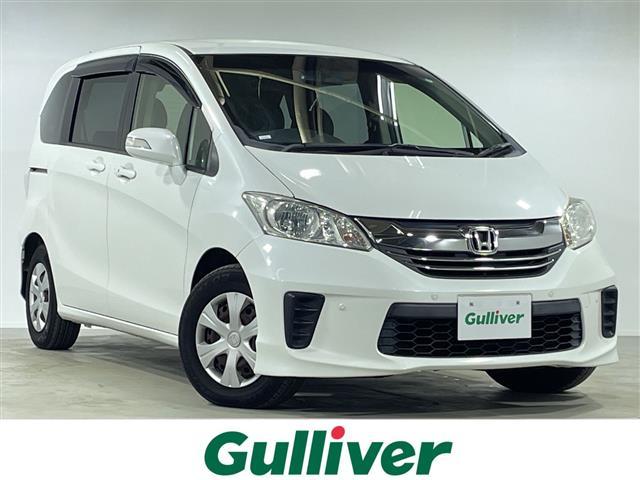 フリード(ホンダ) Ｇ　プレミアムエディション　両側電動　Aftermarket７型ナビ　Ｂカメラ　ＥＴＣ　ＴＶ　クルーズコントロール　ハーフレザーシート　ＨＩＤヘッドライト　オートライト　電動格納ミラー　ウインカーミラー　スペアキー　取扱説明書　スペアキー 中古車画像