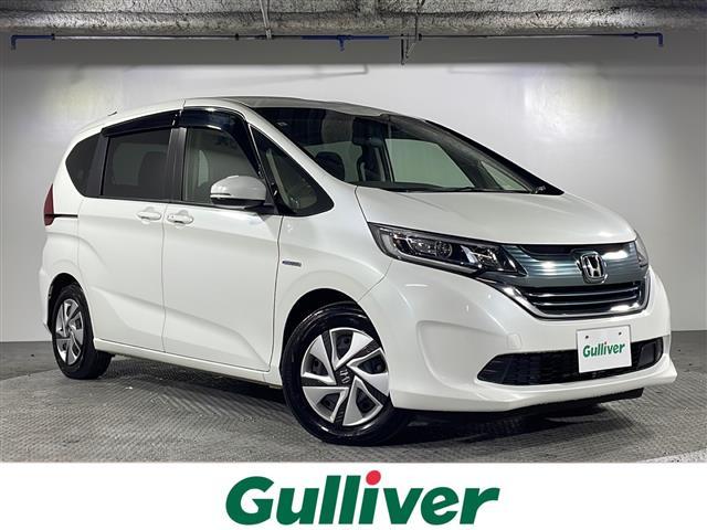 フリードハイブリッド(ホンダ) ハイブリッド・Ｇホンダセンシング　県外仕入れ　禁煙車　６名乗り　純正ナビ　ワンセグ　ＣＤ　Ｂｌｕｅｔｏｏｔｈ　両側パワースライドドア　ホンダセンシング　クルーズコントロール　ビルトインＥＴＣ　スマートキー　スペアキー１本 中古車画像