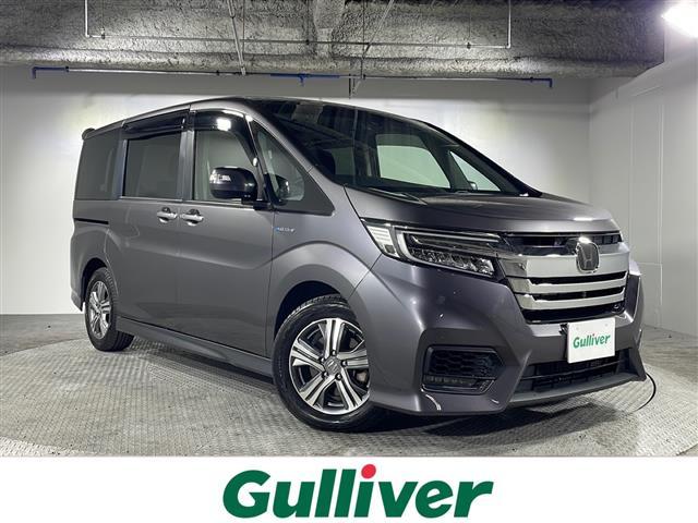 沖縄県那覇市の中古車ならステップワゴンスパーダ スパーダハイブリッド　Ｇ　ホンダセンシング　禁煙車　ホンダセンシング　純正７インチナビ　両側パワースライド　ＣＤ　ＤＶＤ　Ｂｌｕｅｔｏｏｔｈ　フルセグＴＶ　マルチビューカメラ　純正１６インチアルミ　レーダークルーズコントロール　スマートキー