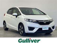 フィットハイブリッド Lパッケージ 禁煙車 純正7インチメモリナビ ETC ドライブレコーダー クルーズコントロール ステアリングスイッチ オートライト LEDライト プッシュスタート スマートキー 電動格納ミラー バックカメラ 中古車画像