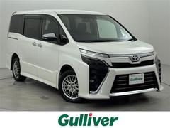 ヴォクシー ハイブリッドZS 煌III 後席モニター 社外ナビ 衝突軽減 PKSB レーンキープ コーナーセンサー クルコン 両側パワースライドドア シートヒーター ETC ドラレコ ドライブモード WAC オートライト 純正アルミホイール 中古車画像