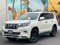 ランドクルーザープラド TX Lパッケージ TRDエアロ RAYSデイトナ20インチホイール フリップダウンモニター 9インチナビ バックカメラ ルーフレール 7人乗り電動サードシート 黒レザーシート エアシート&ヒーター ドラレコ ETC 中古車画像