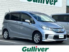 フリードハイブリッド ジャストセレクション 両側パワースライドドア 純正ナビ 地デジTV CD DVD Bluetooth 社外15インチAW シートカバー ビルトインETC バックカメラ スマートキー 中古車画像