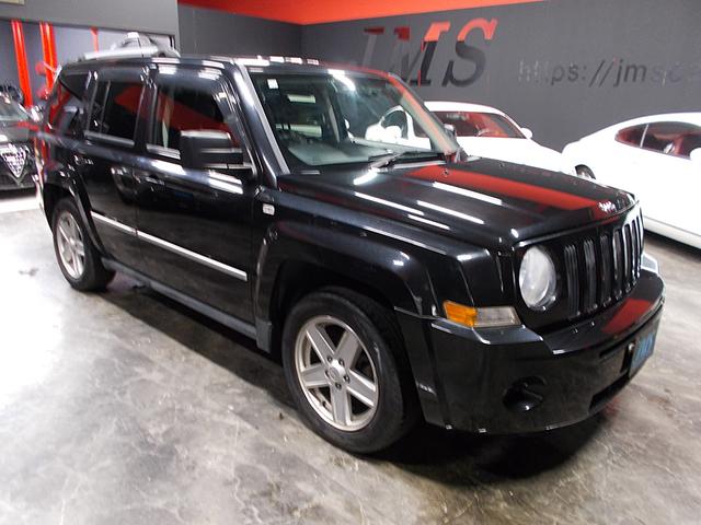 ジープ・パトリオット リミテッド ディーラー整備車両 整備記録簿 フルタイム4WD 黒革シート クルーズコントロール HDDナビ 地デジフルセグテレビ CD録音 DVD再生 USB スペアキー ETC 社外16インチアルミ(5枚目)