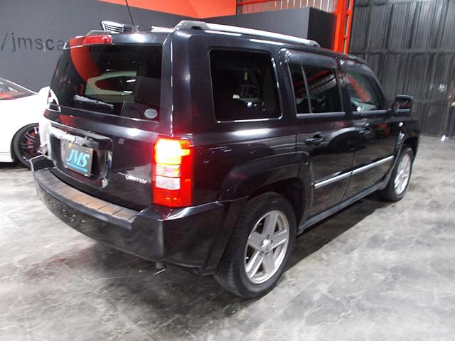 ジープ・パトリオット リミテッド ディーラー整備車両 整備記録簿 フルタイム4WD 黒革シート クルーズコントロール HDDナビ 地デジフルセグテレビ CD録音 DVD再生 USB スペアキー ETC 社外16インチアルミ(6枚目)