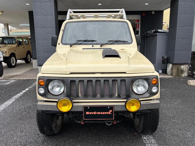 ジムニー ワイルドウインド　リフトアップ　社外オーバーフェンダー　社外フロントバンパー　社外アルミホイール　社外サイドステップ　社外フロントグリル　社外ステアリング　ステアリングダンパー（4枚目）