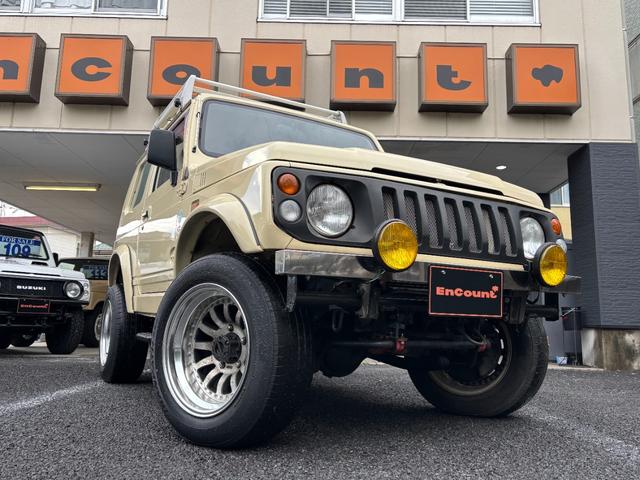 ジムニー ワイルドウインド　リフトアップ　社外オーバーフェンダー　社外フロントバンパー　社外アルミホイール　社外サイドステップ　社外フロントグリル　社外ステアリング　ステアリングダンパー（6枚目）