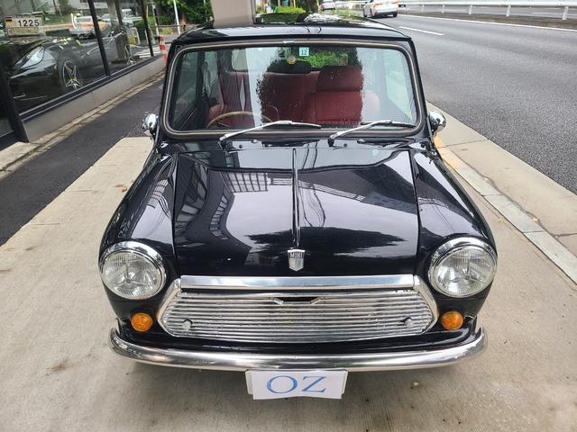 ＭＩＮＩ クーパー１．３　オールペイント済　赤革調シートカバー　コーティング施工車　ウッドハンドル　内外装仕上げ済　前後メッキバンパー　メッキドアミラーカバー　ＣＤデッキ　ＥＴＣ　記録簿　スペアキー（6枚目）