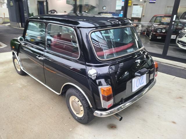 ＭＩＮＩ クーパー１．３　オールペイント済　赤革調シートカバー　コーティング施工車　ウッドハンドル　内外装仕上げ済　前後メッキバンパー　メッキドアミラーカバー　ＣＤデッキ　ＥＴＣ　記録簿　スペアキー（27枚目）