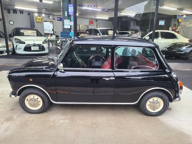 ＭＩＮＩ クーパー１．３　オールペイント済　赤革調シートカバー　コーティング施工車　ウッドハンドル　内外装仕上げ済　前後メッキバンパー　メッキドアミラーカバー　ＣＤデッキ　ＥＴＣ　記録簿　スペアキー（32枚目）