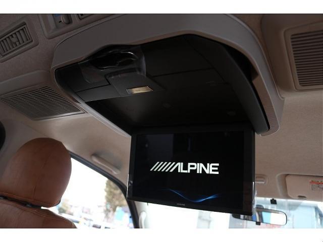 ハイエースバン ロングスーパーＧＬ　丸目フェイスツートンカラーＤＥＡＮ１６インチアルミクラシックオーバルタイヤＢＩＧ－ＸナビＥＴＣフリップダウンモニターメティオサウンドＦＬＥＸシートカバーベッドキット黄木目インテリアパネルステアリング（6枚目）