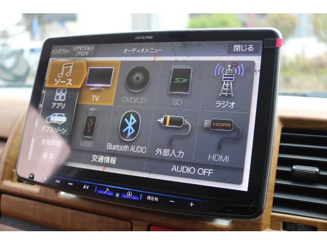 ハイエースバン ロングスーパーＧＬ　丸目フェイスツートンカラーＤＥＡＮ１６インチアルミクラシックオーバルタイヤＢＩＧ－ＸナビＥＴＣフリップダウンモニターメティオサウンドＦＬＥＸシートカバーベッドキット黄木目インテリアパネルステアリング（17枚目）