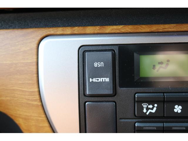 ハイエースバン ロングスーパーＧＬ　丸目フェイスツートンカラーＤＥＡＮ１６インチアルミクラシックオーバルタイヤＢＩＧ－ＸナビＥＴＣフリップダウンモニターメティオサウンドＦＬＥＸシートカバーベッドキット黄木目インテリアパネルステアリング（19枚目）